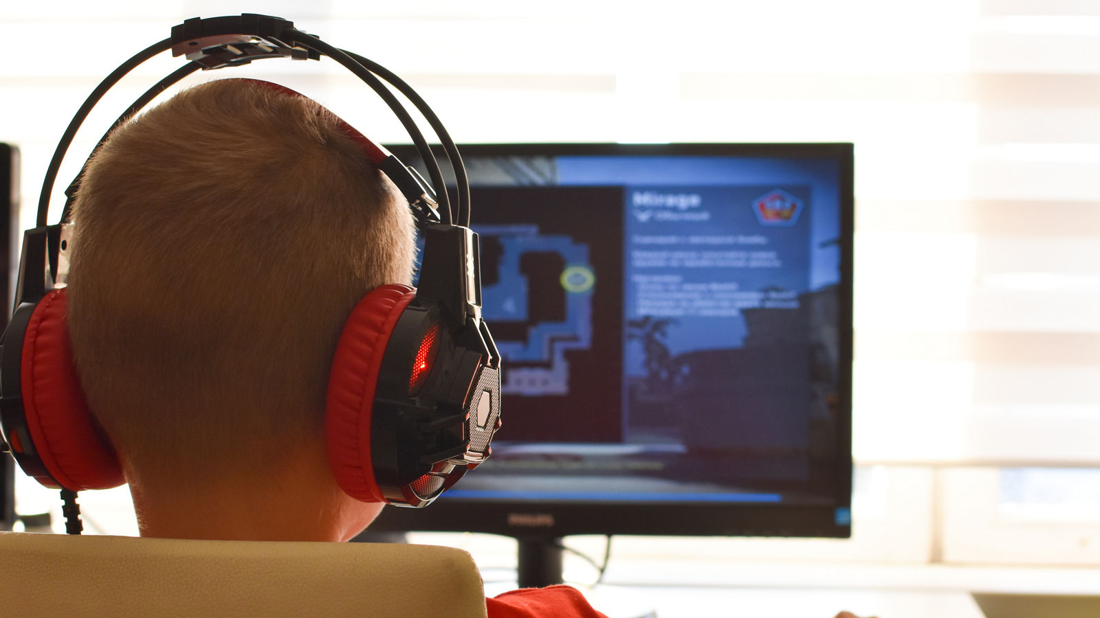 online learning. boy is playing an online game on  internet. children's gambling addiction.