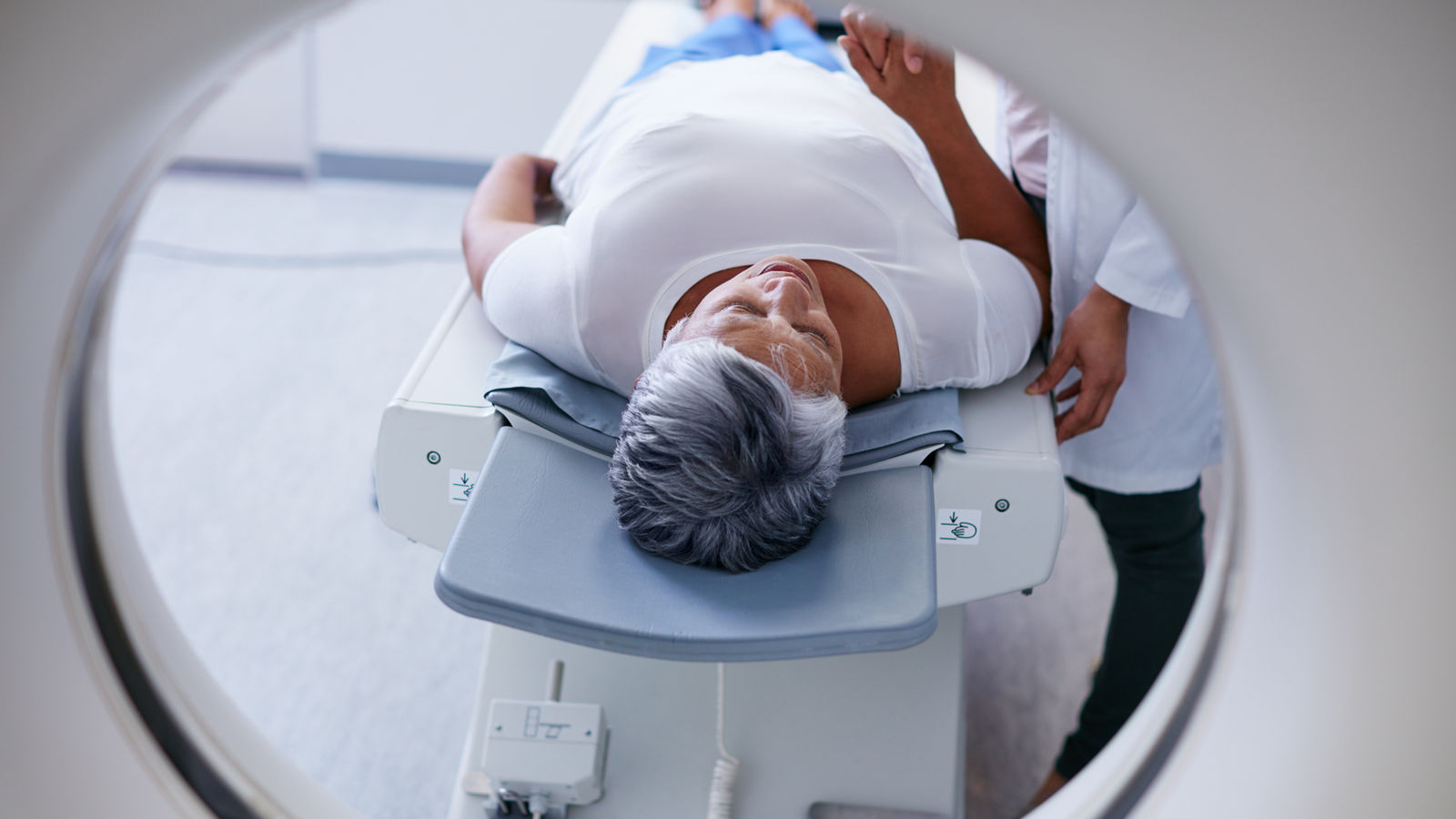 Preparing for the scan. Shot of a senior woman being comforted by a doctor before and MRI scan.