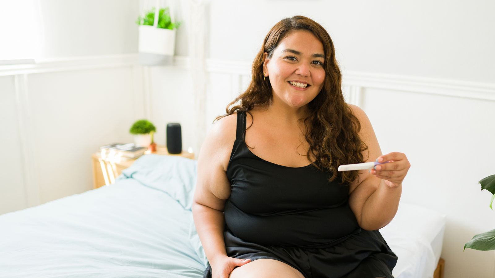 Excited pregnant overweight woman