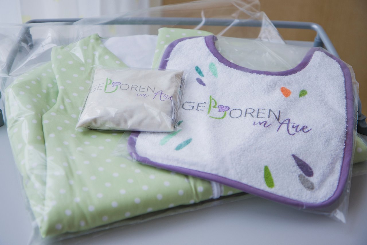 Lätzchen, Kirschkernkissen, Schlafsack zur Geburt