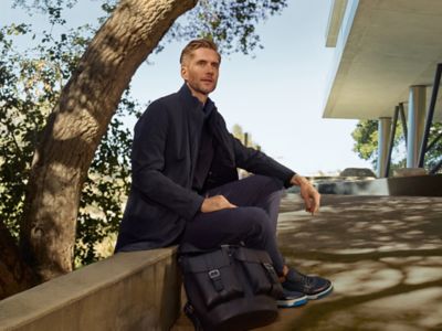 Jeremy Irvine at the beach wearing BOSS