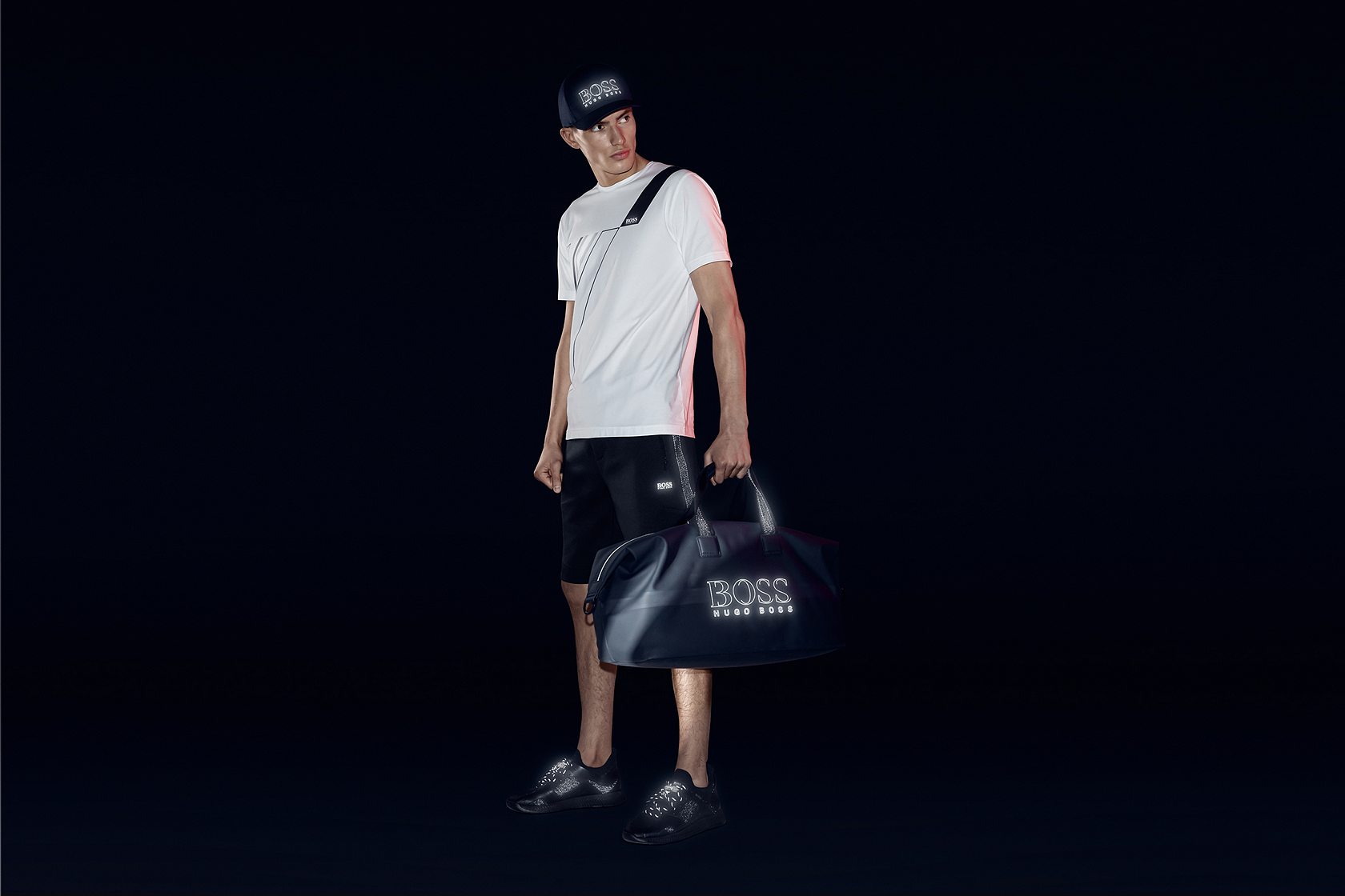 White shirt with black shorts and black shoes with black bag for men by BOSS