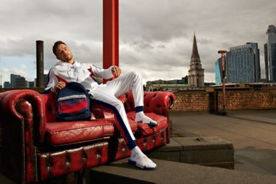 red tracksuit with white writing