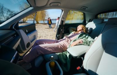 Woman in a drivers seat of a Hyundai IONIQ.