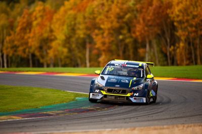 A picture of Hyundai Motorsport customer racing i30 N TCR in action on a racetrack.