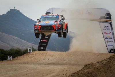 Hyundai i20 Coupe WRC lifting off gravel ground