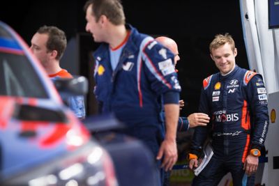 Hyundai Motorsport co-driver Martin Järveoja smiling whilst being in a chat.