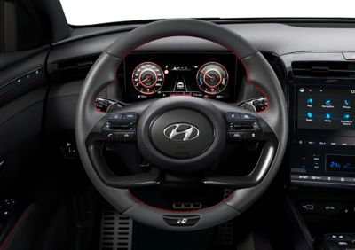Detail of the all-new Hyundai TUCSON Hybrid N Line leather steering wheel