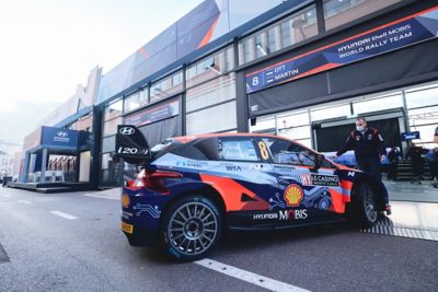 The new Hyundai 2022 i20 N WRC Rally1 at the pit stop on the racetrack.