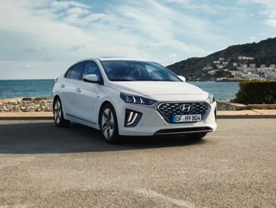 The Hyundai IONIQ Hybrid parked on a waterside.