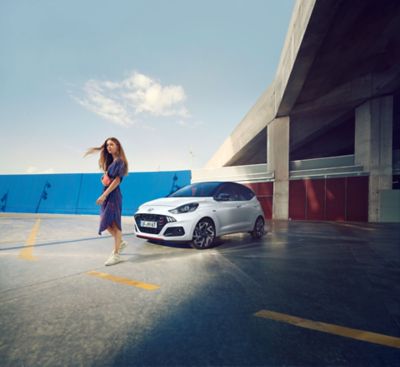 Woman in front of the all-new Hyundai i10 N Line	