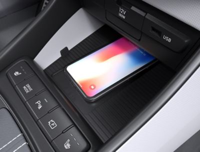 Wireless charging with the centre console of the Hyundai BAYON compact crossover SUV.