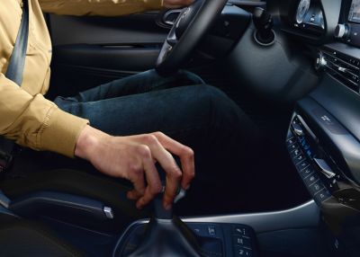 A man operating the 6-speed iMT in an all-new Hyundai i20