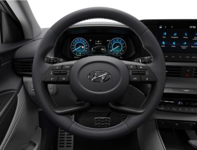 The sporty 4-spoke steering wheel inside of the Hyundai BAYON compact crossover SUV.