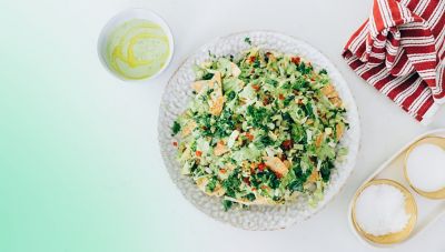 A colourful plant-based lunch pictured from above in a bowl.