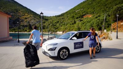 The Hyundai KONA Electric in Atlas White, driven by Veronika Mikos and with additional healthy seas livery