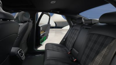 Rear seats with tartan highlights in the Hyundai IONIQ 6 First Edition.