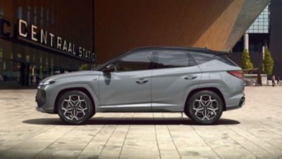 Side view of the all-new TUCSON Hybrid N Line in shadow gray.
