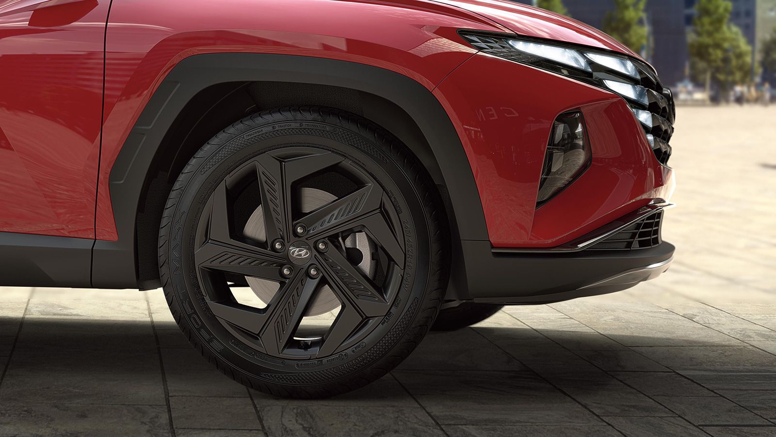 Hyundai TUCSON Plug-in Hybrid in Engine Red detail view of the wheels