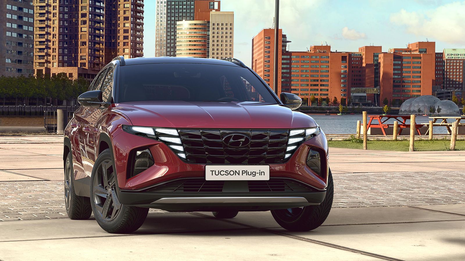 Hyundai TUCSON Plug-in Hybrid in Sunset Red Pearl pictured from the front