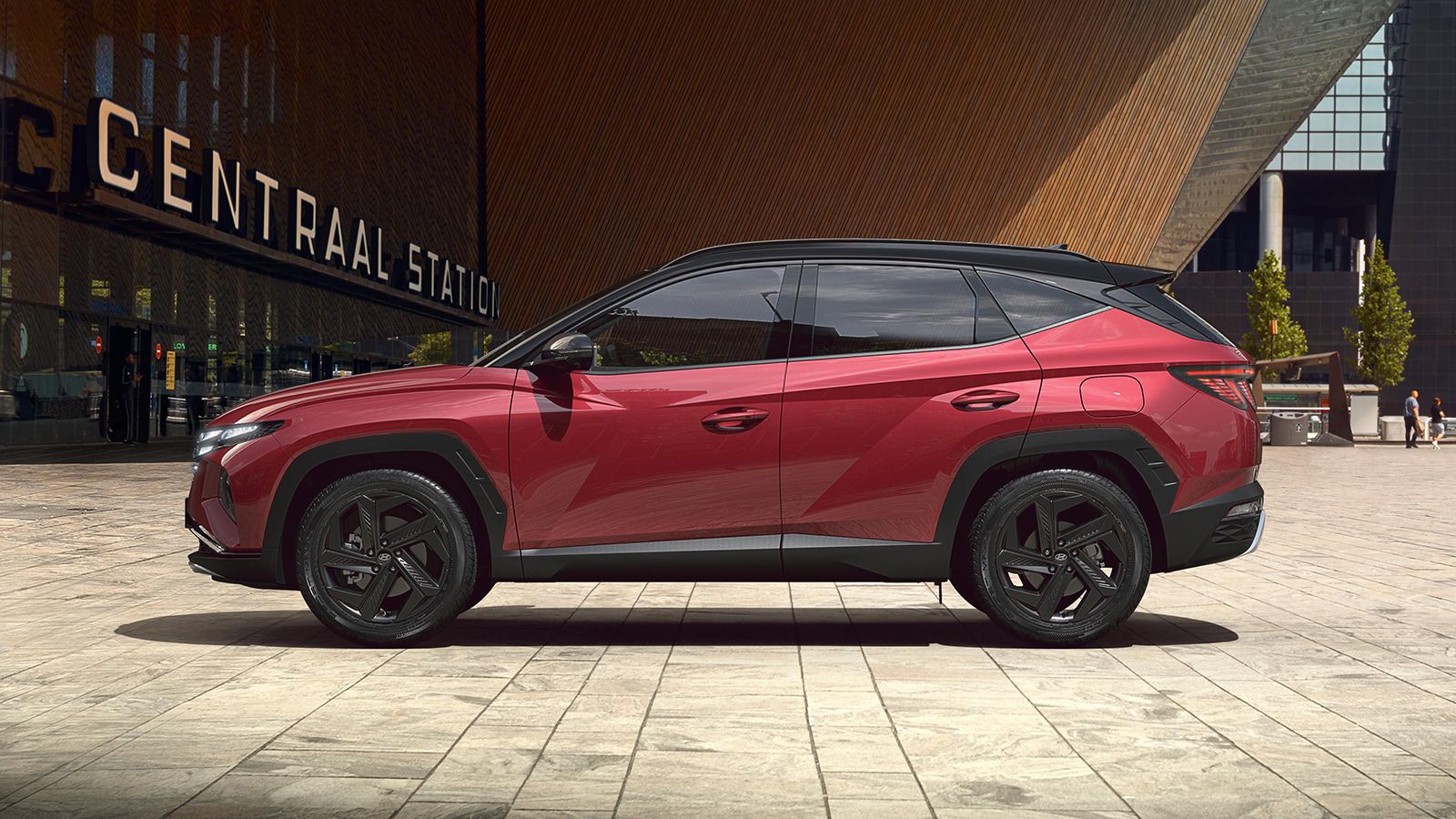 Hyundai TUCSON Plug-in Hybrid in Sunset Red Pearl sideview