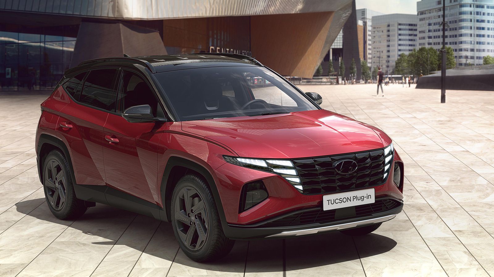 Hyundai TUCSON Plug-in Hybrid in Sunset Red Pearl from the front