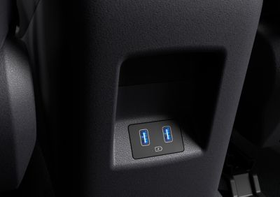 The centre console of the all-new Hyundai Tucson compact SUV showing the front and rear USB ports.