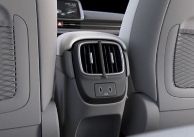 Power outlet with 3 usb chargers in the front inside the Hyundai IONIQ 6. 