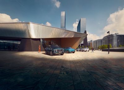 Hyundai's family of electrified cars parked in front of Central Station in a modern cityscape.