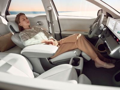The fully reclining front seats of the Hyundai IONIQ 5 electric midsize CUV.