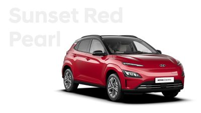 The Hyundai KONA Electric with the exterior colour Sunset Red Pearl.