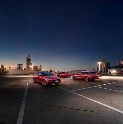 The i30 N Line range on the top of a parking lot.