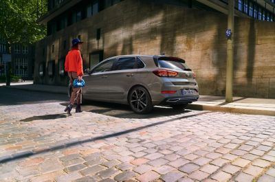 Left-front side-view of the Hyundai i30 on the road.