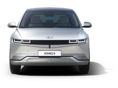The Hyundai IONIQ 5 electric midsize CUV from the front showing its distinctive LED headlamps. 