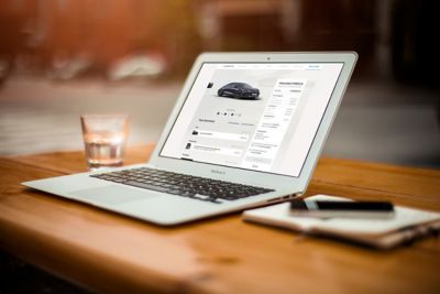 A laptop with an open pre-sale page for the all-electric Hyundai IONIQ 6.