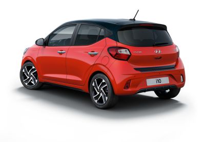 Exterior styling kit on a Hyundai i10 in tomato red.