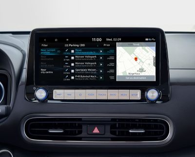 Image of the 10.25-inch screen of the Hyundai Kona Electric, showing on and off-street parking information.