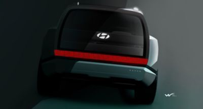 The new Hyundai electric SUEV concept SEVEN from the back with its powerful design.