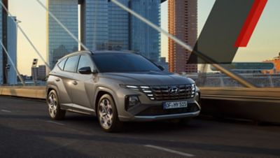 The Hyundai TUCSON N Line driving over a bridge.