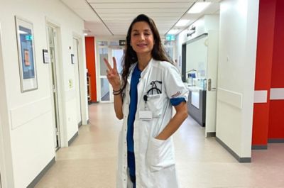 Hyundai Team Century member Nadia Nadim, Danish footballer and surgeon wearing scrubs at a hospital.