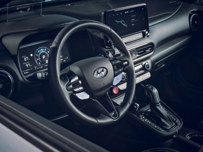 The cockpit of the Hyundai KONA N hot SUV seen through the driver side window