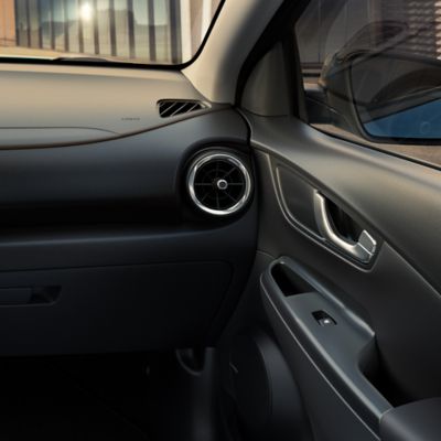 The interior of the new Hyundai Kona Electric in the black one-tone.