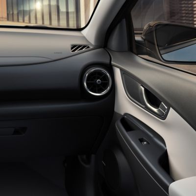 The light Beige two-tone interior of the new Hyundai Kona Hybrid compact SUV.