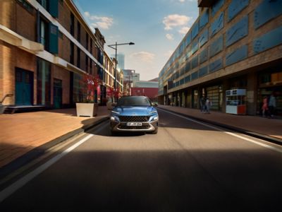 The Hyundai KONA Hybrid on a city street.