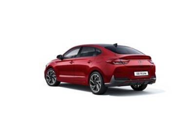 The new Hyundai i30 Fastback pictured from the front, focused on the headlamp.