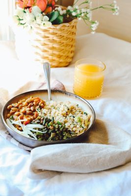 A delicious plant-based lunch with a glass of orange juice