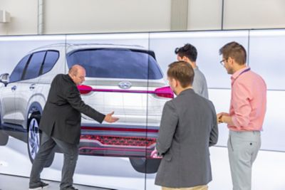 Four designers discussing the rear design of the new Hyundai Santa Fe 7 seat SUV.