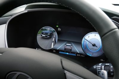 A close-up image of the new Hyundai Santa Fe's new 12.3" fully digital cluster and steering wheel.