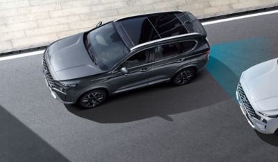 The Hyundai Santa Fe Hybrid from above highlighting the Advanced Driver Assistance Systems.