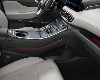 An interior view of the new Hyundai Santa Fe 7 seat SUV showing the tray under the centre console.